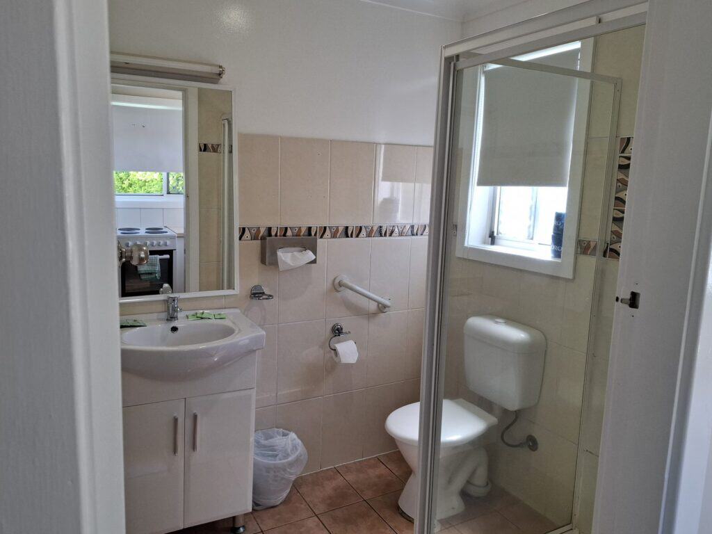 Ensuite bathroom with a shower and vanity